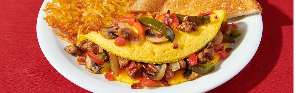 Denny's ultimate omelette served with hash browns and white toast