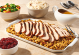 Denny's Thanksgiving Dinner Bundle with turkey, stuffing, mashed potatoes, gravy, cranberry sauce, corn, and mac and cheese
