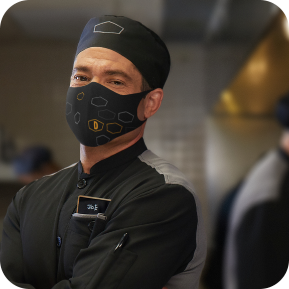Chef Joe with hat and face mask in work gear