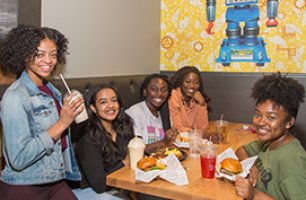 Group of friends sharing dennys